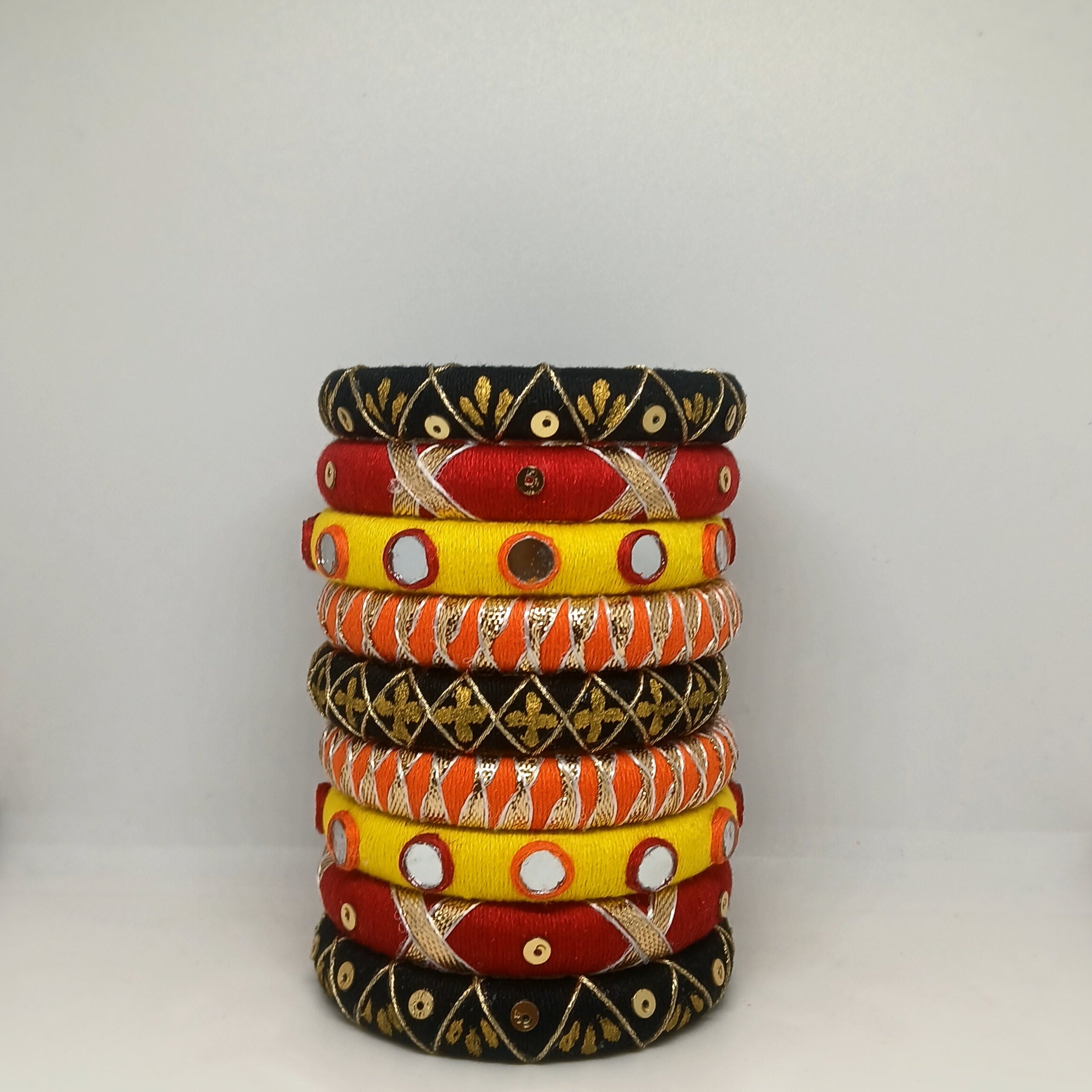 Mandira [Black yellow and red colour handcrafted bangles]