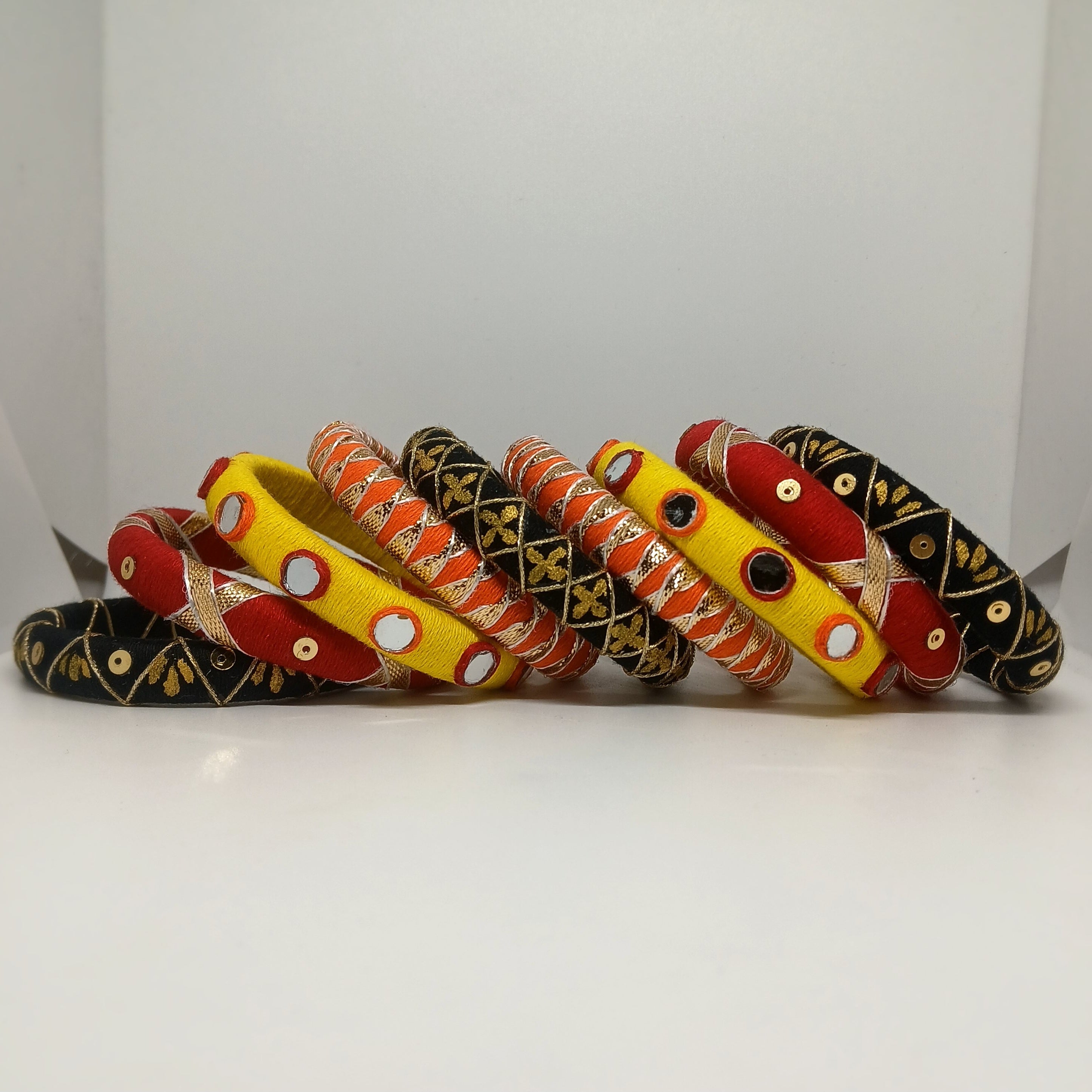 Mandira [Black yellow and red colour handcrafted bangles]